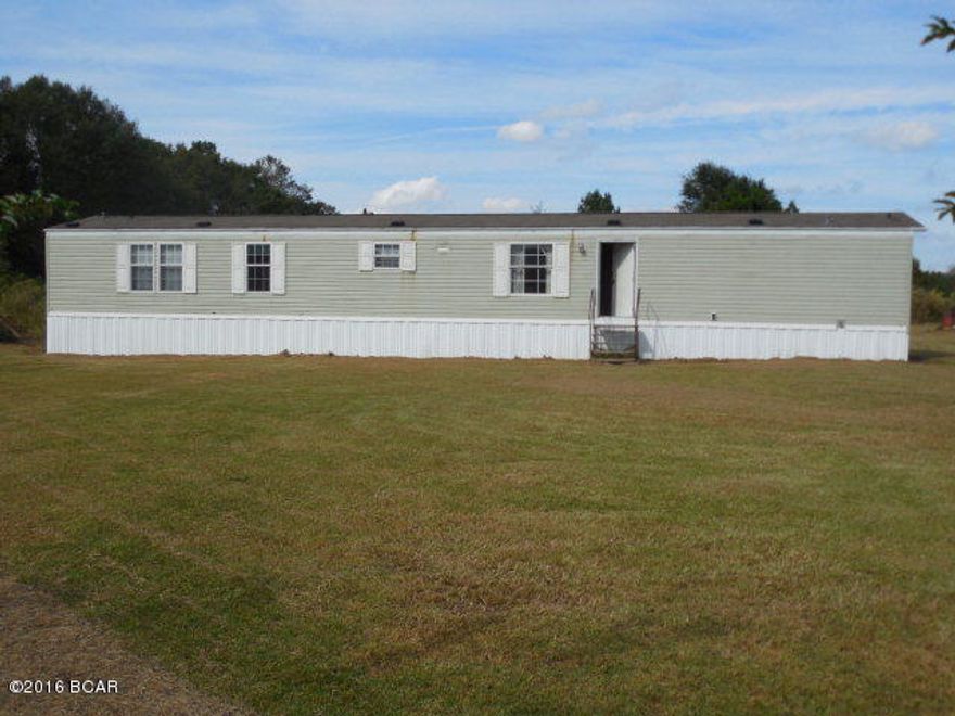 Country Living!! SWMH in Chipley with 4 bedrooms 2 baths with 1064 sq ft on 1 acre! Hardwood floors, carpeting large open kitchen area! Home to be sold in the AS-IS condition. Please call for more information!