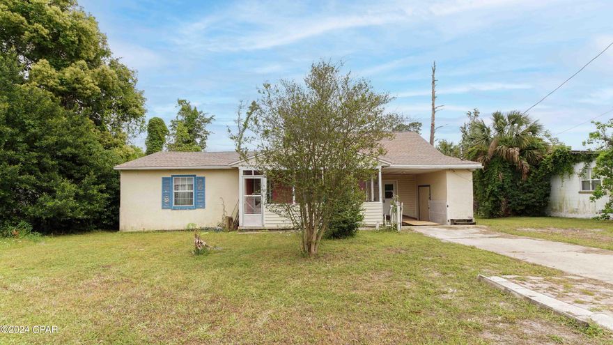 CURRENTLY UNDER CONTRACT, SELLER WILL CONSIDER BACKUP OFFERS CALLING all INVESTORS! Looking for your next project? This property is ready to be transformed to its former glory. Sitting on a spacious lot the exterior features a carport, front porch, roof after hurricane michael, and back patio/deck. The original living room features wood flooring and is open to the original eat-in/dining area. Left of the living room sits two bedrooms and full bathroom with tub/shower combo. Dining area leads to the kitchen featuring a breakfast bar, stove top; And is open to add-on 2nd living room/ dining room featuring carpet and sliding glass doors to the back deck. Just off additional room sits the primary suite or another living room/flex space with wood flooring, closet, and sliding glass doors; full bathroom and laundry room leading to the carport. Take advantage of the affordable price and make this house a home! 
Call to schedule your private showing today! All Measurements approx. buyer to verify if important.