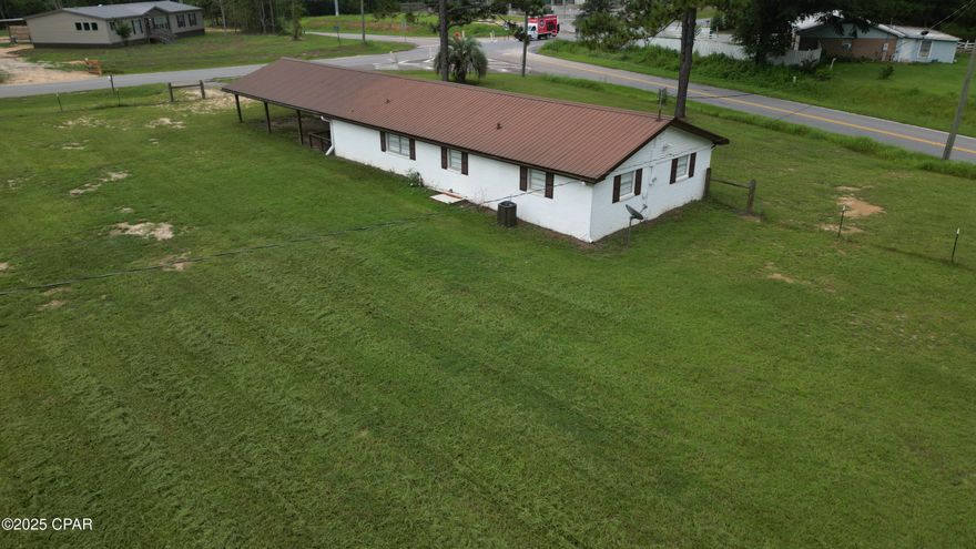 Motivated seller!  Price reduced!  Over 1,600 square feet and 2.5 acres! Discover the perfect blend of comfort and value with this delightful 1,600-square-foot ranch-style home, now available in Bonifay, FL! Situated on approximately 2.55 +/- acres in a peaceful area of Holmes County, this move-in ready home offers an incredible opportunity to embrace a simpler lifestyle without breaking the bank.

Benefit from recent updates, including a new metal roof and stylish blinds throughout. The recently updated kitchen is equipped with stainless steel appliances and opens to a separate dining area, perfect for family meals and entertaining. All three bedrooms feature durable wood laminate flooring and newly installed ceiling fans. The spacious bonus room could serve as a fourth bedroom, home office, or playroom.

A large attached carport (24' X 36') provides covered parking for two vehicles. Additionally, a new 12' x 12' storage shed is ideal for storing tools and lawn equipment. The property is fully perimeter fenced, with one acre fenced separately—perfect for small farm animals. Located on the corner of Boswell Road and Bonifay Gritney Road, this homesite offers easy access to nearby local amenities just a short drive away.

Imagine owning your own piece of peaceful county living without the hefty price tag. This charming home offers the perfect opportunity to grow a garden, raise small farm animals, and enjoy the peace and privacy of rural living. Contact us today for more details!

Key Details:
*Flooring is a combination of LVP and tile
*New roof (replaced in 2023)
*Perimeter fencing - one acre is separately fenced
*New 12' x 12' storage shed
*Oversized carport/patio area (24' x 36')
*Bonifay, FL - 2 miles
*Interstate I-10 - 5 miles
*Dothan, AL - 40 miles
*Panama City Beach, FL - 45 miles