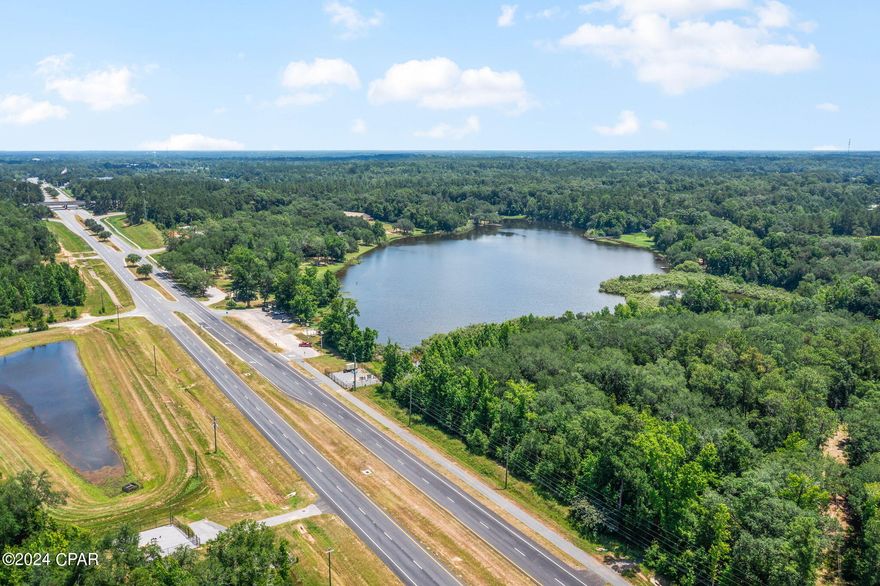 Location, Location, Location! Situated on Blue Lake with approx 486' of Hwy 77 frontage with direct visibility of I-10 sits this rare commercial find with endless possibilities. Has a daily traffic count of 8,500 (2023 DOT Data).