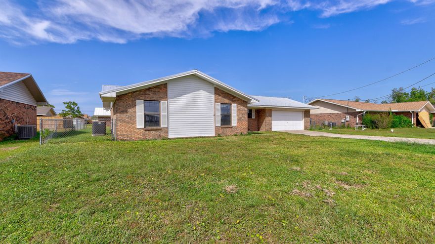 This 3 bedroom home is close to Tyndall AFB and town, NO HOA fees and not in a flood zone. As you first enter the home you will notice a large living room with high ceilings, fireplace and plenty of space, to your right you will notice the dining room area just off of the kitchen that features real wood cabinets, plenty of counter space and a lovely window over the sink to allow lots of natural lighting in to the home. There are 2 bedrooms that are almost complete, just need some drywall finishing, paint and carpet. In the large master bed room, you will find a walk-in closet, large window and a bathroom with a tub shower combo. Both bathrooms have very nice skylights that allow in more natural light, at the rear of the home you will notice a large heated and cooled enclosed Florida r..... ...room perfect for a den or game room. Make your appointment today!