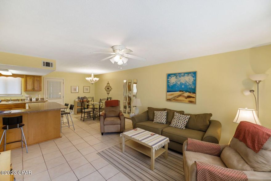 CURRENTLY UNDER CONTRACT SELLER WILL CONSIDER BACK UP OFFERS.  Very nice, clean townhome close to the beach.  Several upgrades have been made including an on demand hot water heater, tile floors downstairs,, custom front door, new cabinets and formica counter tops. new roof and exterior painting.  The complex is gated, with 3.2 miles of wide street area, perfect for walking your dog, or riding your golf cart.  The complex has 4 tennis courts, (2 lighted at night), A two acre miniature golf course. 11 pools, (one on the beach behind the beach clubhouse), and shuffleboard courts.  Also has a play ground for children.  This unit is rent ready and also move in ready.