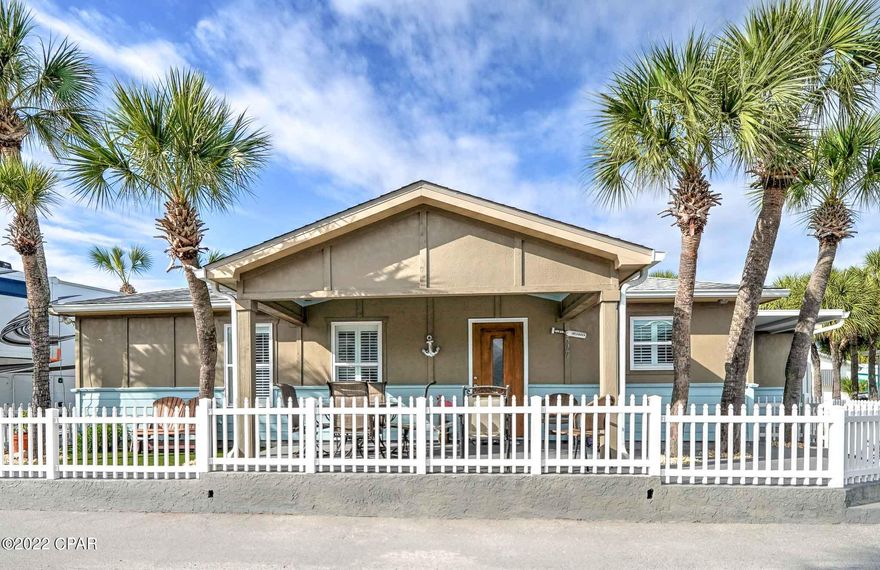 Stunning 2020 build on a corner lot in highly sought-after Venture Out. This 2-bedroom 2 bath home is super charming and has granite countertops, blown in insulation, a 3-ton AC unit and covered porches to die for! All of the rooms are large, even the laundry room...  The covered porch on the front of the home offers the perfect place for grilling and relaxing after a long day on the beach. Great for investment or make this your second home. Venture Out is a golf cart community that has exploded with popularity recently... With 300' on the beautiful pristine beaches of the Gulf of Mexico and 1,000' on the Grand Lagoon. Venture Out has something for everyone. With 2 pools, fishing pier, boat ramp, mini golf, children's playground and much more