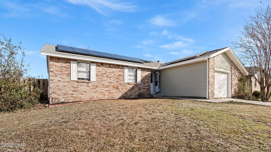 CURRENTLY UNDER CONTRACT, SELLER ACCEPTING BACKUP OFFERS. Great 3Br/2Ba home close to Tyndall.  This home features vinyl plank flooring, real wood burning fireplace, large rooms, and a huge back yard.  Never worry about electric bills again since solar panels were installed in December. Buyer must qualify for assumption of the solar panel payments. Located just minutes from TAFB, shopping, dining, and the beaches!
