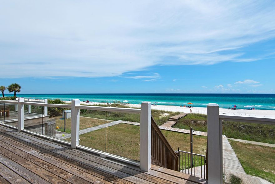 Welcome to 'Tan Lines' A Beachfront Dream Home. Located in the Beautiful Panama City Beach and yet close enough to enjoy all the Luxuries of 30A. Featuring a Private Pool, 7 Spacious Bedrooms, Unique Soho Decor, and Ocean Front. This home is Stunning! Step into the first floor to a Large sitting area, kitchenette that goes to the Gulf Front Grassed Year. The large 2nd floor includes main living, gourmet kitchen, Dining, Large King Bedroom, Additional Bedrooms and walk to the Second floor