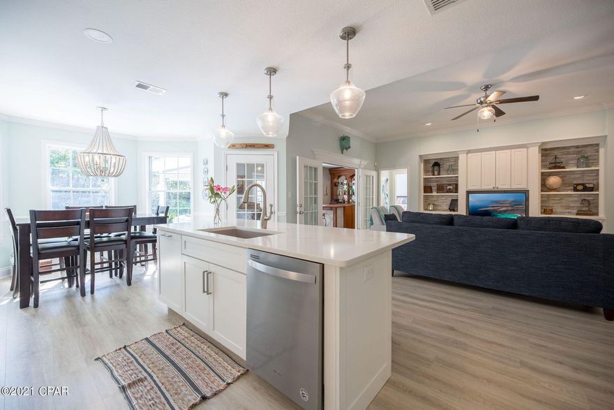 An incredible location! This amazing home is 1-1/2 blocks to the beach and a very short trail walk to a fresh water lake or Aaron Bessant Park.  Use as a primary home, second home or Long Term Rental! Relax in your own heated pool complete with an air conditioned 200+ sq. ft. separate guest cottage with a full kitchen and bath!  HVAC 2017. This home has an incredible amount of upgrades this last year, including; 2021 roof/gutters/facia/soffits - including pool house, new paint, new propane tank/lines added for stove and new pool heater, interior completely remodeled down to the studs. new kitchen including cabinets, island, custom tile, appliances (refrigerator and W/Dryer convey), new floors, solid interior doors, new bathrooms, no maintenance yard, WHeater.  THIS ONE WILL SELL QUICKLY!