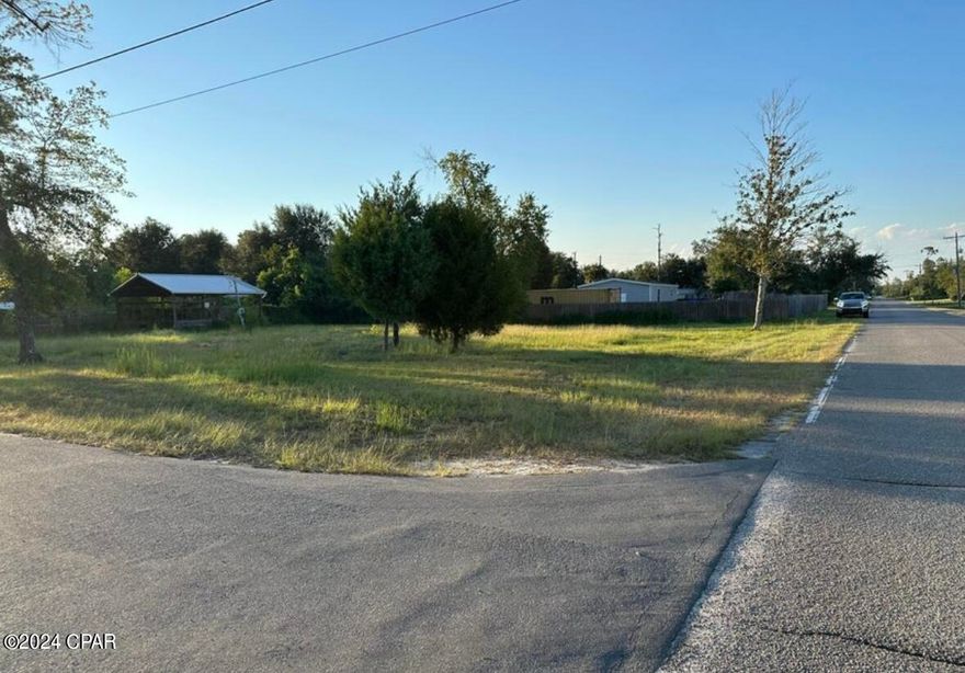 Beautiful half acre corner lot in Bayhead Park just a block away from Deerpoint Lake and Cherokee Landing.  This lot is high and dry, has been professionally cleared, and is waiting for a new home to be built. It is not eligible for mobile homes, but manufactured/modular homes are acceptable. This double lot is great for building your dream home with extra space for a large yard and privacy provided on two sides already. There are two wells on the property, electricity, and a 24x24 pole barn ready to store your toys, or have a workshop. Conveniently located off of 231, it is a short drive to the shopping in Lynn Haven as well as the beaches of Panama City Beach. Buyer to verify all pertinent information. Check out this gorgeous lot and walk to Deerpoint lake while you're there to enjoy the view! More pictures coming soon!