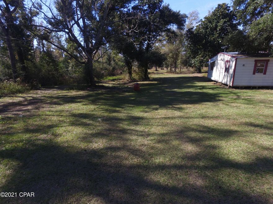 FIVE acre lot that has no deed restrictions. Property has a well and power already on the property.  There are several outbuildings that will convey with purchase.  There is a older septic tank on the property that owner knows nothing about and does not warranty septic system.