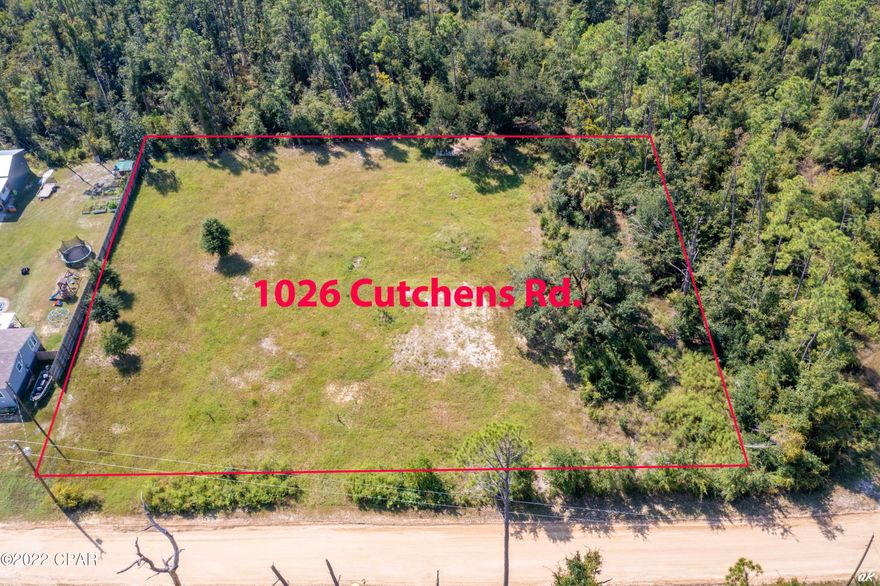 1026 Cutchens Road, Southport, Florida, One acre, 2 wells, septic tank, county water and power all on site, ready to go! With a low inventory, now is a good time to build your own house, your plans, no association, plenty of room for a home, pole barn, pool, home-school / work from home, many options. The location is quiet, private, close to stores, schools, boat ramp / boat life and far enough away from the traffic and lights to enjoy a quiet country night. Survey available upon request. Come view the best homesite available today in Southport!