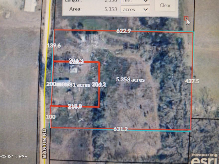 Nice Mini-Ranch with an existing barn and workshop, existing well, nice creek running under several large, Heritage Oaks, existing cow pens and sheds, fish pond, etc.  It is a must see property!  (Note:  The older home at 2318 Martin Rd. does NOT convey with this parcel)  Possible OWNER Financing, with 10 percent down payment.