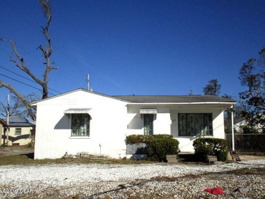 GREAT COVE STARTER HOME WITH SO MUCH POTENTIAL!  Although this home had a few minor roof leaks from Hurricane Michael, it is a concrete-block home and has survived the test of time!  The home features a kitchen with a stainless steel refrigerator, large living and dining area, and a spacious area outside of the two bedrooms that is perfect for bookcases.  This home has loads of potential!  Home sold in its AS IS condition.