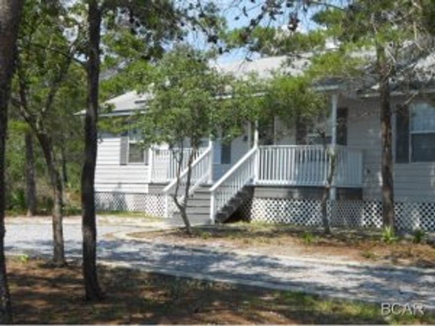 Buy this home with no money down. This home is in immaculate condition and has a great proximity to both the west end of Panama City Beach and 30A area. Enjoy the Lake Powell area with its versatile park for gatherings or to launch your boat or waverunner from the Boat Launch across the lake from Wild Heron. This cute home that was built in 2000 at the West End of Panama City Beach consists of 4 bedrooms and 2 full baths. This property also has enough room to build a garage or out building. Lots of windows make the inside bright and cheery. Home was recently painted and has new flooring with real wood floors in Living room and Master Bedroom. A few new upgrades. Circular Drive and a large deck across the back of house makes this the perfect home for the price. This home is in quiet area of Lake Powell. Huge lot. Will pass any inspections . No waiting to move in, this is a regular sale. Why RENT when you can OWN and pay less. Owner is a Lic Fl. Realtor