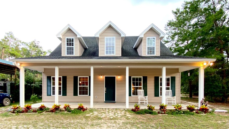 COMING SOON? This beautiful custom built home nestled on 3 acres with plenty of privacy is ready and looking for new owners but is wanting you to COME SOON! Enjoy Country living with the convenience of near by cities. This home was designed for a growing family to enjoy. If 3 bdrms 2.5 baths are not enough room then you will enjoy the huge Bonus room upstairs that can be a great Game room to entertain the kids for hours or make it a Fitness room, Craft room, Office, or even a 4th bdrm. As you enter the home from your picturesque rocking chair front porch, you will notice the stunning oak floors and the Levolor wood blinds which add to this Country Style living.  Kick back and relax in front of your stylish gas fireplace which turns on/off at the flick of a switch.  The Kitchen is brimming gas fireplace which turns on/off at the flick of a switch.  The Kitchen is brimmingwith Country Charm with its Wood Cabinets, Stainless Steel appliances, and a Gas Stove that even Rachael Ray would be proud to cook on.  The French doors in the dining room lead to a 23x12 covered patio for outdoor entertaining. Dad can hide away in his 24x24 workshop or mancave with running water and electricity.  Tell friends and family to bring the RV because there is plenty of room under the 24x60x14 Pole Barn. This is horse friendly community and if you enjoy hunting you can join a hunting lease less than a mile away.  You have all the benefits of country life without giving up the perks of the city. You are only 3 min to Deane Bozeman School, 12 min to Lynn Haven, 20 min to NorthWest International Airport, 25 min to Panama City, 28 min to Pier Park, and of course from there you are only minutes away from the World's most beautiful Beaches.
The wait is now over and the time is right.  Call today and make this your forever home.