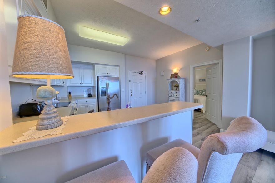 Stunning top floor two bedroom + bunk, two bath at Gulf Crest Condominiums. A rarity to the market! This condo has an open floor plan offering expansive views of the Emerald Waters of the Gulf. It's over-sized balcony is perfect for enjoying incredible sunsets. As you enter you're greeted by a landing space followed by an open kitchen with breathtaking views.  In addition to being a primary or secondary residence, this condo has the potential to gross nearly 50k annually. Gulf Crest is a gated Gulf front community, beautifully landscaped with assigned covered parking, 3 high-speed elevators, 2 large outdoor pools, 2 hot tubs & a kiddie pool. Additionally, there is a Tiki Bar serving food and

beverages. Gulf Crest also boasts poolside wireless internet access, gazebo, three grills, fitness center, game room & direct access to the beach.