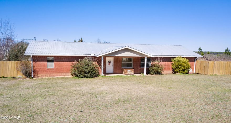 Stunning, brick home surrounded by natural beauty and ample outdoor activities. This 4-bedroom, 2 1/2 bath, split floor plan offers an open concept perfect for entertaining and features a sun-filled living room, dining room and spacious kitchen with an abundance of cabinetry. Retreat to the 19x18 master suite boasting an oversized walk-in closet, attached bath and direct access to the pool while the 3 additional bedrooms and full bath are located on the opposite side of the home. Enjoy your time outside relaxing on the front porch, swimming in the 20x40 saltwater pool, or fishing in the pond. This rare find is situated on 8.3 +/- acres close to Hwy 277 and Vernon.