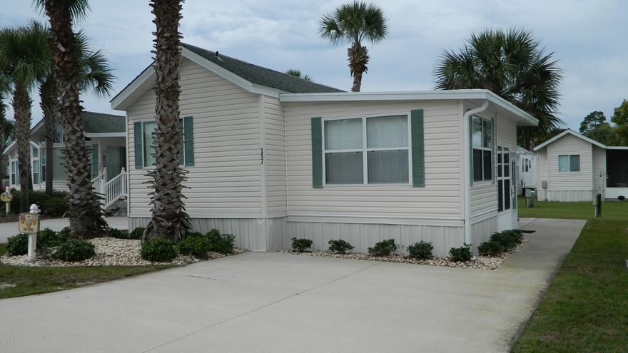 2 bedroom, 2 bath furnished unit that is conveniently located off Thomas Drive in the gated community of Emerald Pointe Resort. The living room offers a sleeper sofa and has direct access to the Florida Room. There is a high-top table with chairs and an additional dining room table with chairs. The master bedroom has a queen bed, built-in drawers and closet to maximize storage space. The attached bathroom has a stand up shower. The second bedroom has a full bed and attached bathroom with tub/shower combo. The resort has two pools, exercise room, clubhouse and playground. Basic cable, water, sewer, garbage included. **1 pet under 24lb negotiable with $250 non-refundable pet fee.