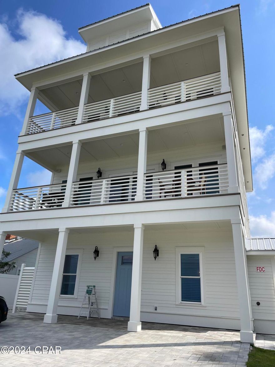 Brand New! Just Finished just in time for the summer. Easy show all weekend.  Open house on 5/25 and 5/26   Experience Unparalleled luxury, This Brand New exquisite 7-bedroom, 7-full bathroom (+2 half baths) vacation rental or primary residence is now ready to go.   Nestled on the tranquil West End of Panama City Beach, this Beach Retreat offers seamless access to the World's Most Beautiful Beaches with a dedicated Private Community Beach access just footsteps away. This Retreat on the exclusive West End has accommodations for up to 18 guests but that's not all, the house has an outdoor entertainment area that is just one-of-a-kind with an Outdoor Kitchen with built in Grill, Refrigerator, Ice Maker, and Bar.  The Pavilion area has a fireplace and outdoor T.V. along with Sound System as well as an oversize Pool, large decks for plenty of outdoor games and a Putting Green on an oversize 50 x 247 lot that will be roomy enough for Weddings, Corporate events or family reunions. The house is a fully furnished Beach House that is truly rental ready. Income models are available, and the property is already on rental program.