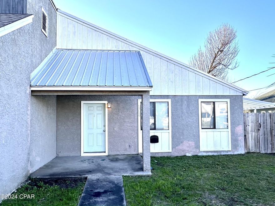 CURRENTLY UNDER CONTRACT, SELLER WILL CONSIDER BACKUP OFFERS Move-in ready 3/2 townhome located in Central Lynn Haven. This home features a spacious living area with vaulted ceiling, wood and tile flooring, newer kitchen cabinets with granite countertops and matching SS appliances. Exterior features include large fenced back yard, nice covered porch, large driveway and metal roof. The home is a 2 minute walk from Cain Griffen Park, which has playgrounds, tennis and basketball courts, kiddy area, and softball/baseball field's. In close proximity to schools, shopping, dining, entertainment and doctors offices. No HOA. Flood zone X which means flood insurance is not required. Call now for your exclusive showing.