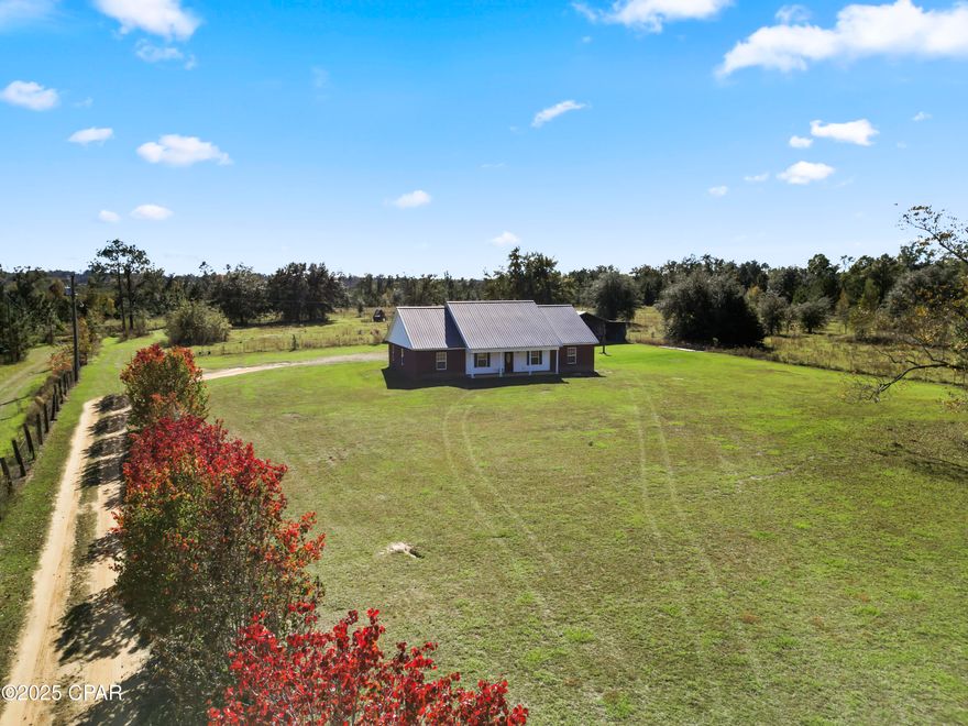 This is a must see! 3 bedroom 2.5 bathroom home situation on 2.5 acres +/- in rural Jackson County, Florida! Sitting across the road from an 8,000 acre WMA that is loaded with wildlife and less than a five minute drive to a public boat ramp on 37,500 acre Lake Seminole! Split floor plan with brand new carpet in bedrooms, new refrigerator, oversized carport with enclosed storage room, and 36'x55' pole barn. Property is also partially fenced. Set up your showing today as this one won't last long! All measurements are approximate please verify if important. Storage shed doesn't covey, will be moved prior to close of escrow.