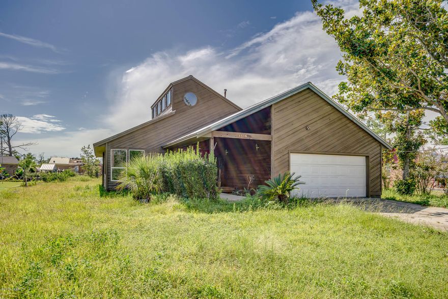 CURRENTLY UNDER CONTRACT, SELLER ACCEPTING BACKUP OFFERS. Spacious home with tons of potential! Cedar siding recently sealed and painted with weather shield exterior paint. A/C systems recently replaced. Entry way with coat closet and stained glass doors open into living area. Large loft looks over the family room and living room. Carpet throughout bedrooms, living area, and hall replaced in the last few years. Master bedroom connecting to a florida room would make a great office area or hobby room. Large back patio and  back yard is the perfect place for enjoying the Florida weather.