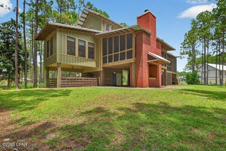 CURRENTLY UNDER CONTRACT, SELLER WILL CONSIDER BACK UP OFFERS
Owner said price it to sell. You simply will not find a better priced home of this quality in RiverCamps. 3 large bedrooms, each with an ensuite bathroom with walk-in tile showers, solid wood Australian Hickory floors throughout, except wet spaces. Modern kitchen with granite countertops and stainless-steel appliances. Master suite is on main floor with the 2 guest bedrooms upstairs. Large screened in porch with beautiful brick woodburning fireplace. 
Home has been exceptionally cared for. New AC units in 2022 and 2023. Repainted exterior in 2022, interior repainted in 2023 and new water heater in 2023.
This home is located on .99 acres, has modern finishes highlighted with rustic charm making it ideal for full-time living or a vacation getaway. 
RiverCamps is a gated, waterfront, outdoor enthusiasts dream! Located on the banks of Crooked Creek, West Bay and the IntraCoastal Waterway, with direct access to the Gulf, owners enjoy their own community boat ramp, dry boat storage, day-use boat slips, wash stations, over 7 miles of connected boardwalks and trails, unlimited use of kayaks, canoes and paddleboards. Newly completed zero-entry pool and pavilion. 600 ft pier, pickleball courts and even an owner's campsite with an adult and kid tent on the banks of the Crooked Creek with a bathhouse.
Comprising of 1500 acres, 1000 of which are committed to conservation, there will be less than 450 homesites on the remaining 500 acres.
RiverCamps is conveniently located 10 miles from world class shopping and dining at Pier Park and the famous white sandy beaches of Panama City Beach, less than 10 minutes from the NW Florida Beaches International Airport and 2 miles from the just announced Publix grocery store and 500,000 sq ft of retail space expected to be completed in 2026. RiverCamps is far from the crowds and traffic yet close to everything!