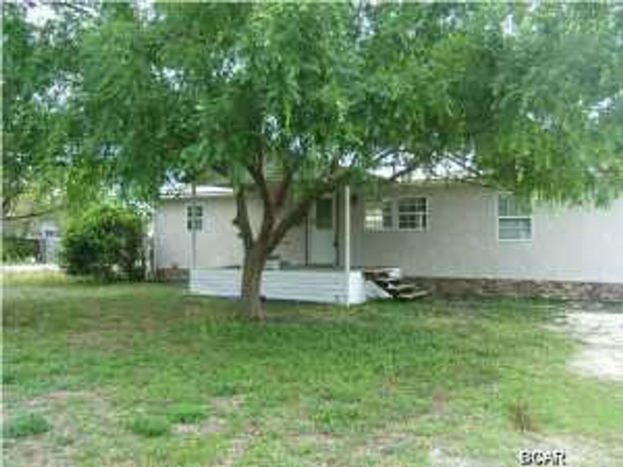 Double wide home with 2x4 wood walls. New interior lighting, paint, floors. Corner lot with large backyard and irrigation system. Laundry room in detached building for with work shop. New roof. You must see the upgrades in this home. This is really affordable living close to the close to the beach and near Patronis elementary.