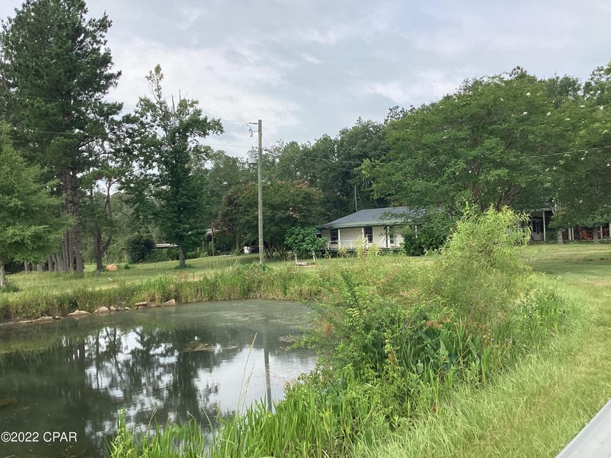 PRICE has been reduced and put back on market.: 15 acres fenced, with 5 ponds, beautiful trees. The Double wide home has been redeveloped with additional living space: Large living room,large kitchen, with plenty of cabinets. 4 bedrooms, 2 full baths, walk in closets, dressing area; extra large laundry room, 17'x19' game room; 9' x 11  office, and huge 20 x 28 family room with wood burning fireplace. Property needs work and restoration inside and out. There are several out buildings, and a horse stall; Fruit trees and flowering plants.Plenty of space to add a barn or another home. Property has great potential. AS IS ONLY, must be CASH.