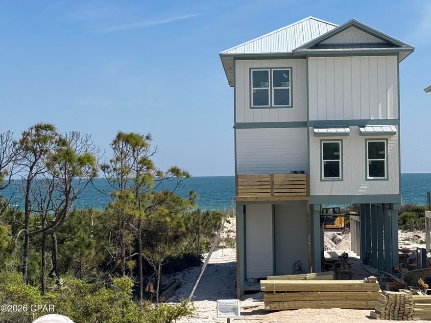 GULF FRONT LIVING AT ITS BEST! Relaxed coastal living reaches a new level at this beautifully designed gulf-front home with direct beach access in Heron's Crossing, a premier enclave within Casa Del Mar at The Plantation on St. George Island. Perfectly positioned along the shoreline, this 4-bedroom, 4-bath residence offers 2,344 square feet of thoughtfully crafted living space that blends luxury, comfort, and the effortless rhythm of island life. Designed for both gathering and unwinding, the open-concept layout is filled with natural light and showcases high-end finishes throughout, including designer cabinetry, premium countertops, and a chef-inspired kitchen complete with a professional-grade range, custom vent hood, and stainless steel appliances. Wide-plank flooring, elevated trim details, and a refined coastal palette create a sophisticated yet inviting atmosphere. Living spaces flow seamlessly to expansive outdoor areas where the Gulf takes center stage. Step outside to your private inground pool, where days are spent soaking in the sun and evenings are defined by breathtaking coastal sunsets. With the beach just steps away, the shoreline becomes an extension of your backyard. Each bedroom offers space and privacy, making this home ideal for full-time living, a luxury vacation retreat, or a high-performing rental. From morning coffee with coastal breezes to evenings filled with the sound of waves, every moment is designed to elevate your lifestyle. Located within the gated Plantation community on St. George Island, residents enjoy pristine beaches, nature trails, and a peaceful, unspoiled coastal setting. This is more than a home--it's a rare opportunity to own a true gulf-front escape and LIVE THE BEACH LIFE. NOTE: Photos shown are from a completed showcase home in the community and are for illustrative purposes only. The featured home shares the same floor plan; finishes and selections may vary.