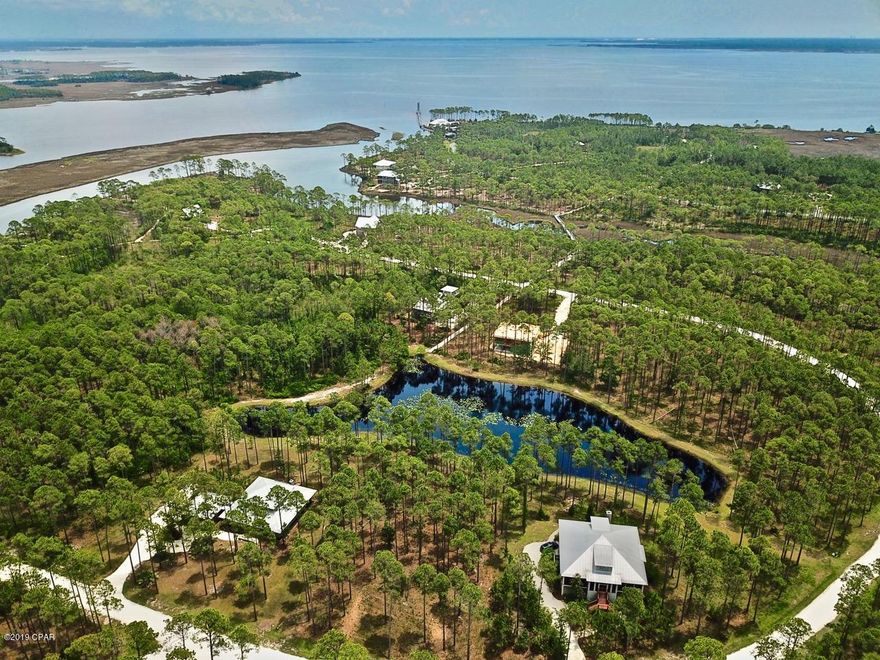 Rivercamps on Crooked Creek is Panama City Beaches best keep secret. This gated community is nestled between Crooked Creek, West Bay, and the intercoastal waterway. The amenities included a zero entry pool, community areas, playground, exercise facilities, kayaks, bikes, trails, pickle ball, and more!  Rivercamps  is also close to the Worlds most beautiful beaches, ECP airport, Pier Park, FBP, and so much more. This is a beautiful,  large, waterfront lot. Paradise found!