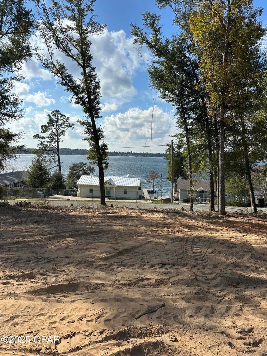 Discover the perfect spot to build your dream getaway on this beautiful waterview lot overlooking the sparkling waters of Compass Lake. Perched on a gentle hill, this cleared and ready-to-build homesite offers stunning views of one of the area's most beloved recreation lakes—ideal for water skiing, wakeboarding, jet skiing, and endless days of fun on the water. With its peaceful setting and unbeatable scenery, this lot delivers the ideal canvas for your vision. Come enjoy the charm, the views, and the lifestyle—your dream location awaits.