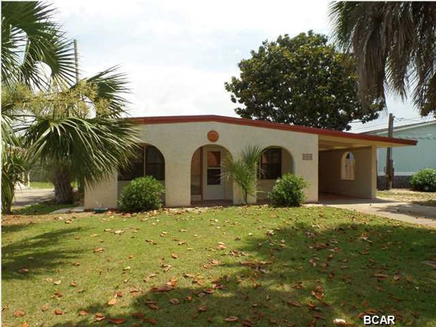 Lovely beach home with in ground pool, fenced back yard, 2 bd, 1 ba, carport and just one block from the Worlds Most Beautiful Beaches! This home is a Spanish style bungalow with a 16x12 yard building which could be used as a pool cabana. Many upgrades such as tile through out and new stainless appliances. This home would be great as a weekend getaway or could be used for vacation rental for an investor. All information is believed to be accurate and correct; buyer to confirm & verify if important. All measurements are approximate.