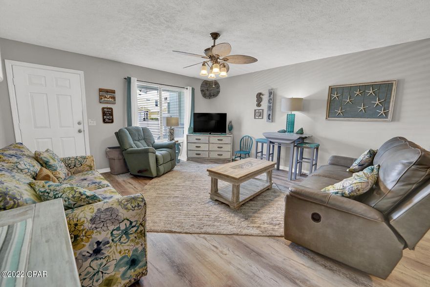 Fantastic Vacation Rental Opportunity with NO HOA is just steps to the sandy white beaches! The townhome also features a new water heater installed in 2021, new plumbing in 2014, LVP flooring, new electrical box and breakers. The owners also installed a new back door, locks and doorknobs. There is a shed in the back yard for storing beach chairs and floats. This townhome is set up to entertain your friends and family and is a must see if you are looking for a 2nd home or vacation rental!  These townhomes are currently in the process of a septic to sewer conversion, please see the documents for more information on that process.