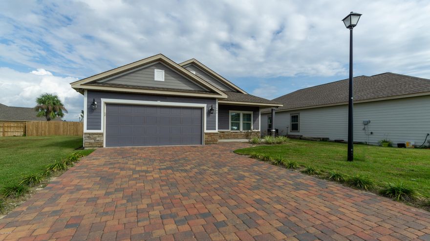 Beautifully Designed Craftsman Home awaiting a New Owner in Desirable Hidden Ridge neighborhood. This home is designed with an Open Floor Plan with Tile Floors, Wainscotting in the living area, Granite Countertops, Stainless Steel Appliances, 8 foot Doors, 9' Trey's in the Living Room & Master Bedrooms. 10' Ceiling's with Arch walkways. Plenty of storage and living space throughout the home. Master Bedroom is carpeted and has a large walk-in closet with a Master Bathroom that offers a grand tile shower with glass enclosure. Pavered Driveway as you drive up and located at the end of the road towards the cul de sac. Covered Patio on Front & Back of the home for entertaining, large garage attached. Come view this home today!