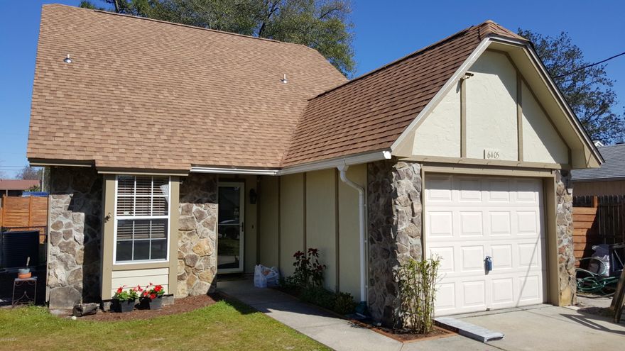 NEW ROOF, convenient to town, close to the bay for boating or fishing and a kid friendly neighborhood.  These are just a few of the advantages of buying this beautiful, newly remodeled home.  The owners are putting a brand new roof on this home, right now.  There will be no worries in 5 years about where the money will come from for repairs.  You will have a warranty for the roof.  Need a little privacy?  This split bedroom floor plan will give you just that.  Upon entering the home you will notice the high ceilings and large tiled floors immediately.  The newer appliances and large farm style sink will leave you worry free in the kitchen, while the neutral colors will allow you to decorate according to your tastes.  The home has been freshly painted, so no need to stress before moving in. How about a heated and cooled sunroom with beautiful white French doors for entry and a deck in the back yard for entertaining.  Sound good to you?  Well this home has it all and not to mention the mature natural vegetation for shade, the ready made garden awaiting your personal favorites and a fenced back yard for the kids to play.  The home boasts a loft or office upstairs.  Call today for a private showing and you may own this home soon.