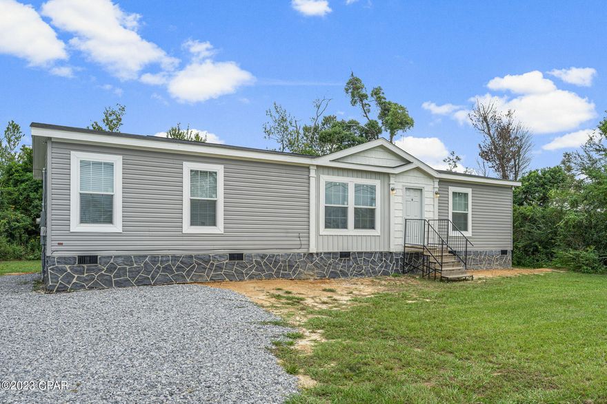 CURRENTLY UNDER CONTRACT, SELLER WILL CONSIDER BACKUP OFFERS - You'll fall in love with this charming mobile home located in the heart of Callaway!  Sitting on a large .64 acre lot, this 1 year old property still smells brand new!  Walls are drywall (not wall board), and the home has been equipped to be energy efficient.  Stainless steel appliances and walk-in pantry adorn the kitchen and a Culligan reverse Osmosis system provides fresh water.  The brand new well is also filtered by a Culligan softener (owned) and a  Simply Safe Security system also conveys with the home.  Cost for the security subscription runs about $30 a month.   All bedrooms have walk in closets.  Skirting along this gem is stucco and the septic tank was just inspected in 2022.
Restaurants, shopping, and schools are all within 2 miles, Hospital is 5 miles, Tyndall Air Force Base is 7.4 miles, the beach is about 15 miles, and shopping at Pier Park is 23 miles.  If measurements deemed important, please verify.