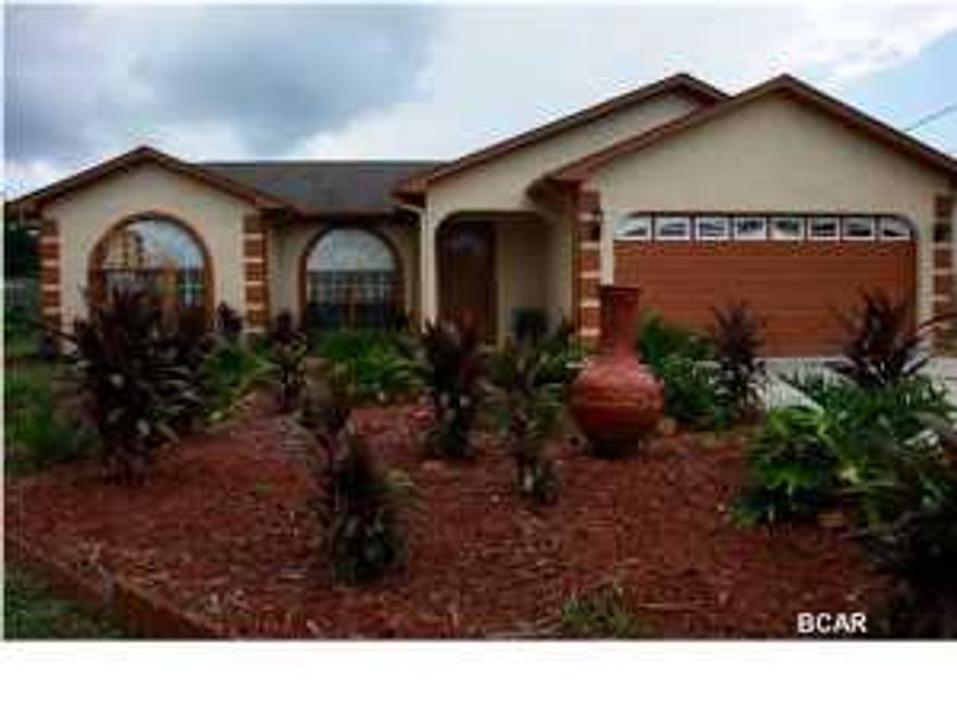 Great new listing in awesome location close to Pier Park. This home features a split floor plan with cathederal ceilings, 2 car garage, and a large privacy fenced back yard with storage shed. Call today for appointment!