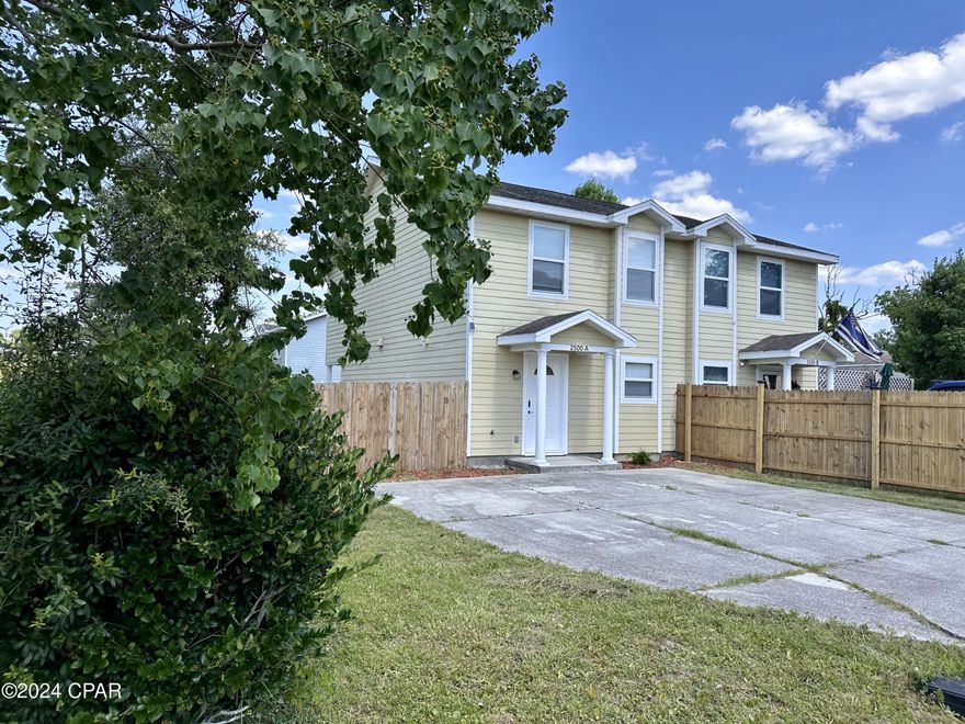 Turn key 2Bd/2.5Ba townhome located on a corner lot on a quiet street. First floor features the kitchen with new stainless steel appliances and tile flooring, spacious living space and a convenient half bath. Beautiful French doors open onto the spacious fenced back yard with covered porch and side entry gate from road. Second floor features two nice size bedrooms with new LVP flooring throughout and two full bathrooms with tile floor. Other features: large driveway, laundry room with washer and dryer, fresh interior paint. This home is minutes to the beach, college, Pier park, navy base, Publix sports park, shopping, dining & more! Perfect as a primary residence, vacay home or as investment property. No HOA. No rental restrictions. Short-term rent allowed! Flood zone X, which means flood insurance is not required.