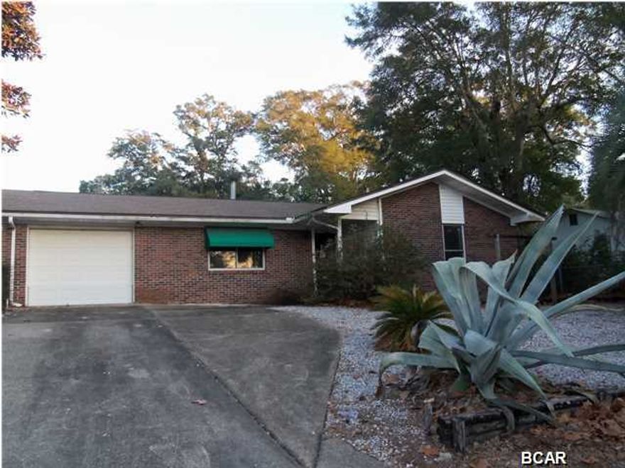 Brick and vinyl home in St. Andrews. Convenient to 15th Street, this St. Andrews home is very charming and has had some recent upgrades, including: granite countertops in the kitchen, roof permit was pulled in 2005. This home also features formal living room, large dining room, family room with fireplace and 2 large bedrooms, 2 baths and a Florida room. 1 car garage is large and has storage cabinets! Nice yard with raised planters and a shed. Priced to sell! (all sizes approximate and taken from public records, buyer to verify any details buyer deems important).