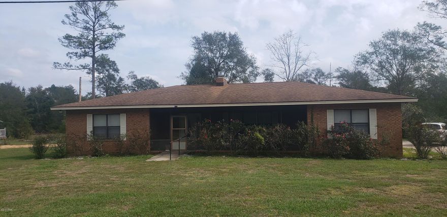 CURRENTLY UNDER CONTRACT. SELLER WILL LOOK AT BACK UP CONTRACTS. Country setting in the city with this spacious 4/2.5 brick home.  Home offers a kitchen with lots of storage and island, dining room, living room with fireplace, family room with half bath, master bedroom with master bath, 3 additional bedrooms and full bathroom. Bonus room for additional space. Laundry has extra room for pantry items. Above ground pool. Screened in front porch. Some updates include tile flooring and paint. Attached carport. 20x40 Workshop with a roll up door. 60x32 pole barn with electric and power. Sits on a 6.2 acre corner lot.