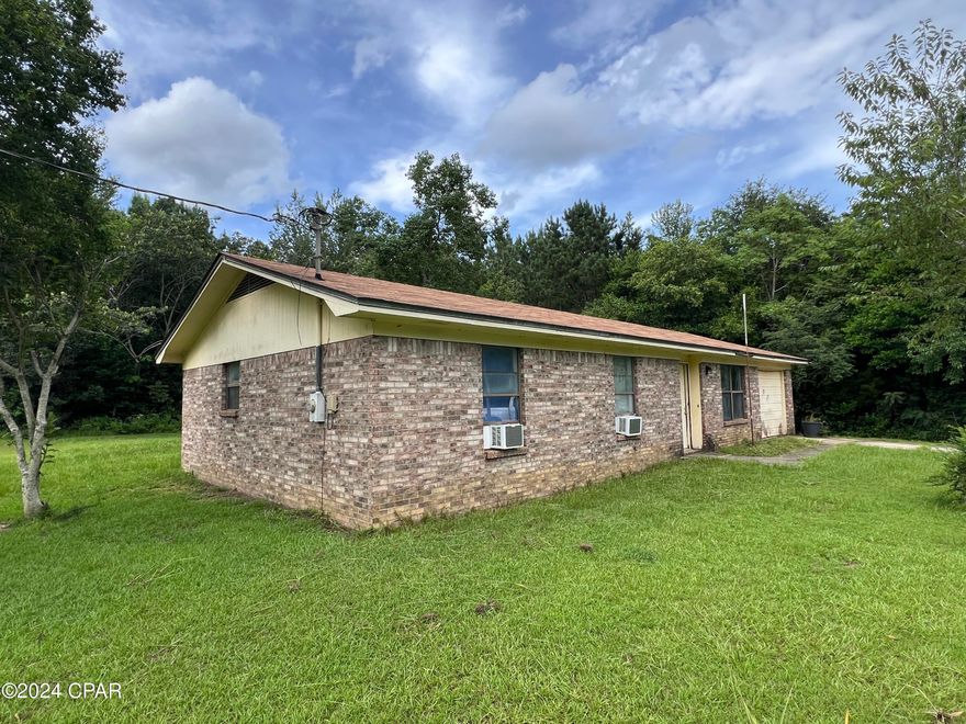 Home is located in north Holmes County Florida in the Esto community.  Located just a couple blocks off of Hwy 79.

3bed/1.5ba brick home that needs work - roof and bones appear to be in good condition. No floor covering in multiple rooms.

Septic and city water. Currently has window units and wall heaters for heating and cooling.

Wood kitchen cabinets. Closed in garage could be enclosed for additional room.