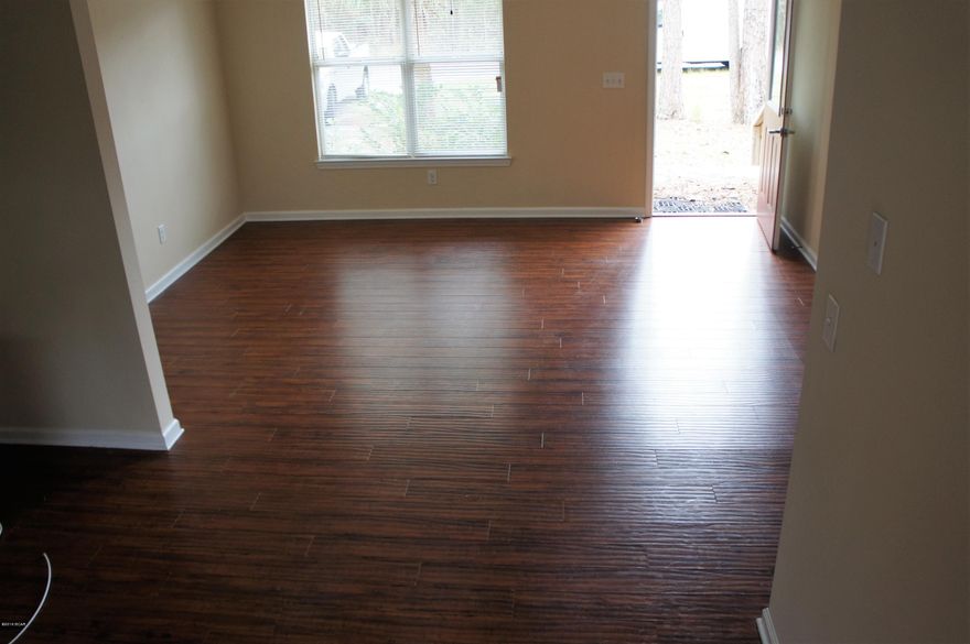 REO foreclosure, three bedroom / two bathroom, laminate hardwoods.

Gigantic 100x125 lot.

Private culdesac, palm trees, secluded yard, beautiful front porch and back porch.

Kitchen contains no appliances but does have corian countertops, and custom cabinets.

Bathrooms have shilestone countertops and custom tile.

''Newer'' carpet, single pane windows, beveled doors, ''newer'' HVAC handler and power unit.

Crawl space, no attic.

Internet cable ready.