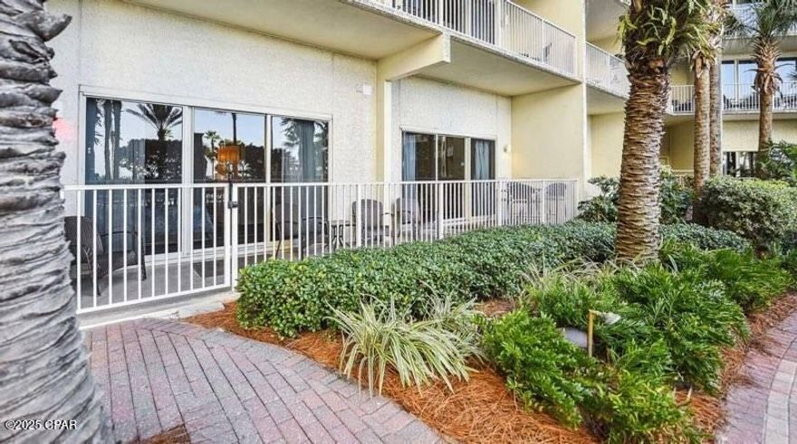 PREMIUM POOL LEVEL FIRST FLOOR CONDO.  List price was just reduced by a large amount. These do not come available often. Walk directly out on the best  and largest pool deck in Panama City Beach. No pool area in PCB comes close to Shores of Panama. The gulf front pool area has a lagoon pool, a zero-entry tropical pool, a hot tub all lined with palm trees and fountains. The luxury pool area opens directly out to the beach and beautiful emerald  water of the Gulf of America. There is a full service snack bar on the pool deck and an ice cream and  donut shop adjacent to the pool area.  There is also a large indoor pool on the bottom floor. The  Master bedroom and the family room opens onto the porch by the pool deck to form a huge porch area that runs the whole width of the condo. This is a east side condo that has a breathtaking view of the sunset. NO STAIRS TO WAIT ON TO GET TO THE POOL OR BEACH. This is a 2 bedroom condo that feels like a 3 bedroom because the bunk room has a door for privacy. The is a trundle bed under the bunk bed. Each bedroom has a full bath and the half bath is just down the hall from the private bunk room. It has been recently updated throughout. The AC, hot water heater and washer and dryer have all been replaced in the last year.  There is no carpet, all of the flooring is tile. This successful rental ready condo comes fully furnished.  A deeded parking spot comes with the condo. The Shores of Panama has a 24/7 guard gate.
This special condo is a great vacation rental. Make an appointment to view it today.