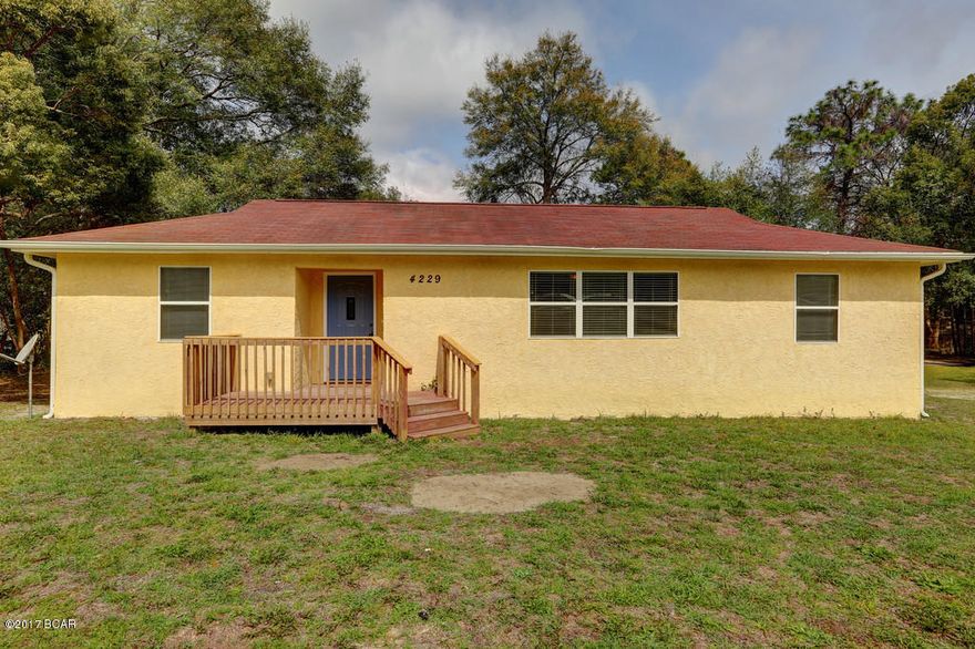 Absolutely adorable. Take a look at this cute Florida Cottage centrally located close to the new North Bay Haven school! At just under 1400 sq ft, this home has been completely renovated since 2007 and features 3 bedrooms, 2 baths, large living room, eat in kitchen area with a defined eating space and a large living room with beautiful real hardwood floors! Huge rooms makes this house feel so much bigger than it is! Owner's suite is 12x20 - it is huge!!! Large living room and kitchen - kitchen has tons of cabinets and laundry room has extra storage for anything oversized, plenty of windows and natural light. Decks in the front and back offer extra space for entertaining and you'll really like the 1/2 acre lot that is completely fenced and has a nice carport. Neat and clean! Click ''more'' Renovations include: new windows, new roof, new stucco, new gutters, new cabinets (kitchen & bathrooms), new fixtures, new electric, new plumbing, real hardwood flooring, new doors & trim, new water heater, new appliances, new carpet, new paint. Complete list of renovations available through your agent! Great value for the work that's been put into this lovely home! Make an appointment to see this fantastic home today! (all sizes approximate and taken from public records, buyer to verify any details buyer deems important).