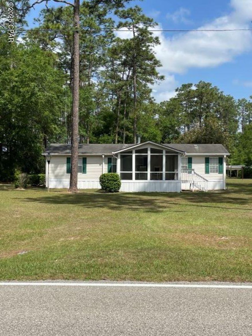 $175,000. SALE PENDING! This immaculate country home has 131 ft. frontage on a paved state road adjoining national forest land. Just bring your clothes and personal items and start enjoying the peace and serenity of country living at its finest! This well-loved and well-maintained 2003 double-wide home is furnished and waiting for a new family to start enjoying it! With 3 BR's and 2 baths and 1,440 sq. ft. of comfortable heated/cooled living space, the home includes a 16' x 22' living room with fireplace, separate 9' x 10' dining room, 12' x 13' kitchen, and 5' x 7' laundry room. The master BR is 13' x 15', and the spacious master bath has both a shower and a tub. Connected to the 4' x 6' covered back stoop is a 14' x 20' 1-car carport plus a 9' x 14' storage or workshop building. In addition to the carport and connected workshop are 2 other metal storage buildings and a concrete block pumphouse which provide plenty of extra storage or workspace. Sit on the 16' x 16' screened front porch and enjoy the views of U. S. National Forest land, and wildlife, in front of and also on one side of this .72-acre parcel. Septic tank and well water. (The block pumphouse has a pump that was disconnected from electricity, since water is currently coming from a pump that sits on a family member's adjoining property. The owner has an arrangement with the family member to pump water from his well, but the electricity to that pump is connected to the subject property and is paid for by the current owner. There is a possibility that the same arrangement might be made with a new owner, but it is definitely something that would have to be discussed and worked out. The pump in the block building could be reconnected to the electricity and used to provide water again from that well which sits on this subject parcel.) Out-of-state owner no longer uses this property. Make it yours and start enjoying the home and all the amenities for just $175,000!