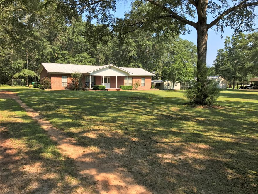 Centrally located between Panama City and Dothan Alabama. Next to HWY 231 and just south of Interstate 10. Beautiful brick home with 4 bedrooms and 2 baths. Covered carport with 2 parking spaces. Nice yard with shade on a quiet road. Perfect for a big family!!