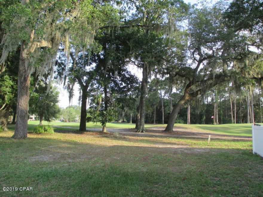 Purchase this rarely available individual townhouse lot in the secluded Country Club in Lynn Haven overlooking the golf course to build your home on. Closed community with a guard house that is partially manned for your security. You will see people walking, running, walking their dogs and playing golf. Join the Country club and enjoy all the amenities it has to offer. Call today