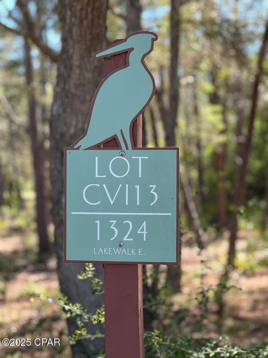 Build your dream home in beautiful Wild Heron, a 700+ acre Coastal Sanctuary situated on Lake Powell.  This lot backs up to fairway 7 and the conservation area.  Enjoy the privacy of a wooded lot, while also taking advantage of the many Wild Heron amenities including community pool, boardwalk walking paths, boat house with kayaks and paddle boards.  NOTE:  Seller also owns adjacent lot which may be available for purchase also. Combined, the two lots are just under 1/2 acre.