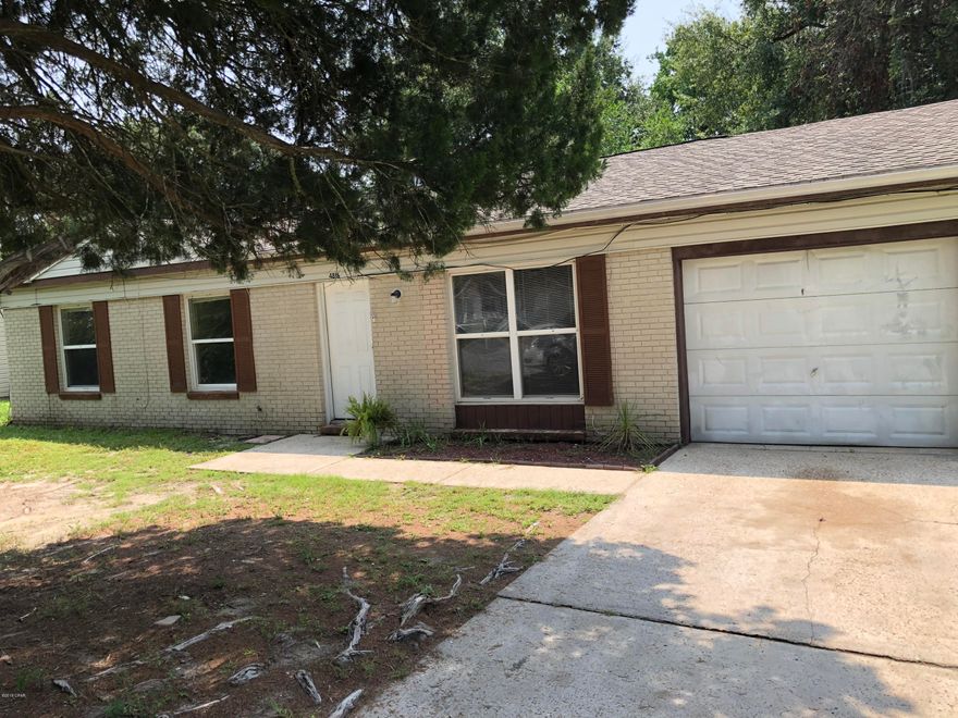 Great location for this 3 bedroom, 1 bath home. It is close to Tyndall Air Force Base, schools, Restaurants and Shopping. Step out onto the spacious deck and enjoy the large privacy fenced back yard that is shaded by mature trees.The 12x24 foot Den has a fireplace and a sliding door to the deck, making a perfect room for entertaining or playing with the kids.The home also features a separate living room and a large eat in kitchen that is open to the Den/Family room. The sellers are offering a $3000 flooring allowance at closing. Easy to show. Owner is in process of making repairs due to storm damage. Please verify all measurements if important.