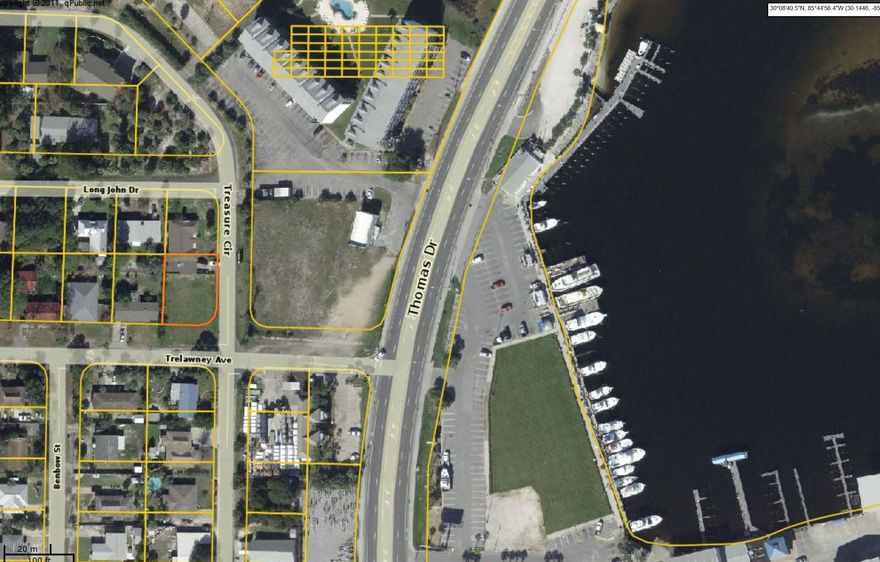 Extra Large corner with 75 feet frontage and 100 feet deep. Like getting a lot and a half as most lots are 50'. Lagoon view just 1 block off Thomas Dr at the lagoon bridge. Lot is already cleared and ready for your home to be built. Sewer across the street. View of lagoon and great location newt to lagoon bridge on Thomas Dr. CHEAPEST LOT BELOW LAGOON. OTHER LOTS ARE 50'' AND ABOVE $125K   * one of the sellers is a licensed FL. Real Estate agent. .