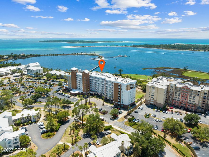 CURRENTLY UNDER CONTRACT, SELLER WILL CONSIDER BACKUP OFFERS
Experience the best views in Panama City Beach! Located directly on Grand Lagoon, the highly coveted Reflections at Bay Point boasts picturesque views of not only the lagoon, but also of St. Andrew Bay, the emerald waters of the Pass, Shell Island, St. Andrews State Park, and Pelicans Bar and Grill over the lagoon. Between the boats returning from their day at sea, breathtaking sunrises/sunsets, active wild life such as dolphins and herons, and golfers swinging on the signature fifth hole of the only Nicklaus Course in NW Florida, it will be hard to leave the private, screened-in balcony. 

Inside Unit 402, you'll find the owners spared no expense in updating many features over the past three years, including new HVAC, Water Heater, LG Stainless Steel Appliances, washer/dryer, ceramic tile plank flooring, smart TVs, updated furniture, and a completely new walk-in, tiled shower. The tinted windows in the unit provide enhanced privacy while also reducing the heat coming through the windows from the sun. 

Onsite at Reflections, you'll find a 10,000 sqft tropical resort style pool (seasonally heated), hot tub, fire pit, grill station, small fitness center, and 11,000 sqft full-service Serenity Spa and Salon. When you get hungry, head next door to the Bluegreen Vacations Bayside Resort, where you'll find 4 great options for food (Cabana Cafe, Flip Flop's, TIDES Restaurant and Lounge, and Pelican's). Watersport Rentals, private charters, adventure tours, and Shell Island Shuttles are all available through the Paradise Adventures Kiosk, which is located on the pathway out to the dock. 

As if all this wasn't enough, Unit 402 is also on Vacasa's Rental Management Program, boasting rental projections of over $40k. Many weeks in May, June, and July have already been booked, meaning your new condo will generate income from day one! So don't wait! Call your agent today, and schedule a showing!